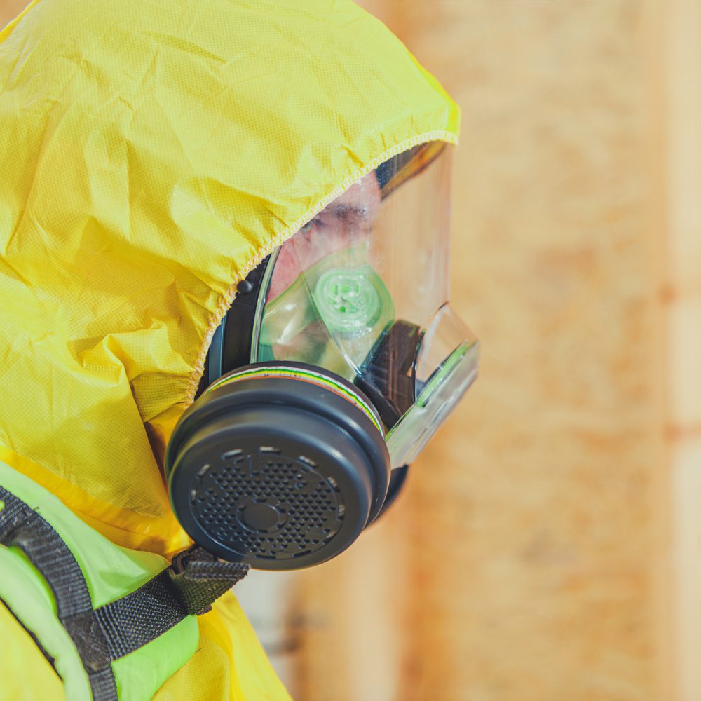Asbestos Removal Technician In Hazmat Suit