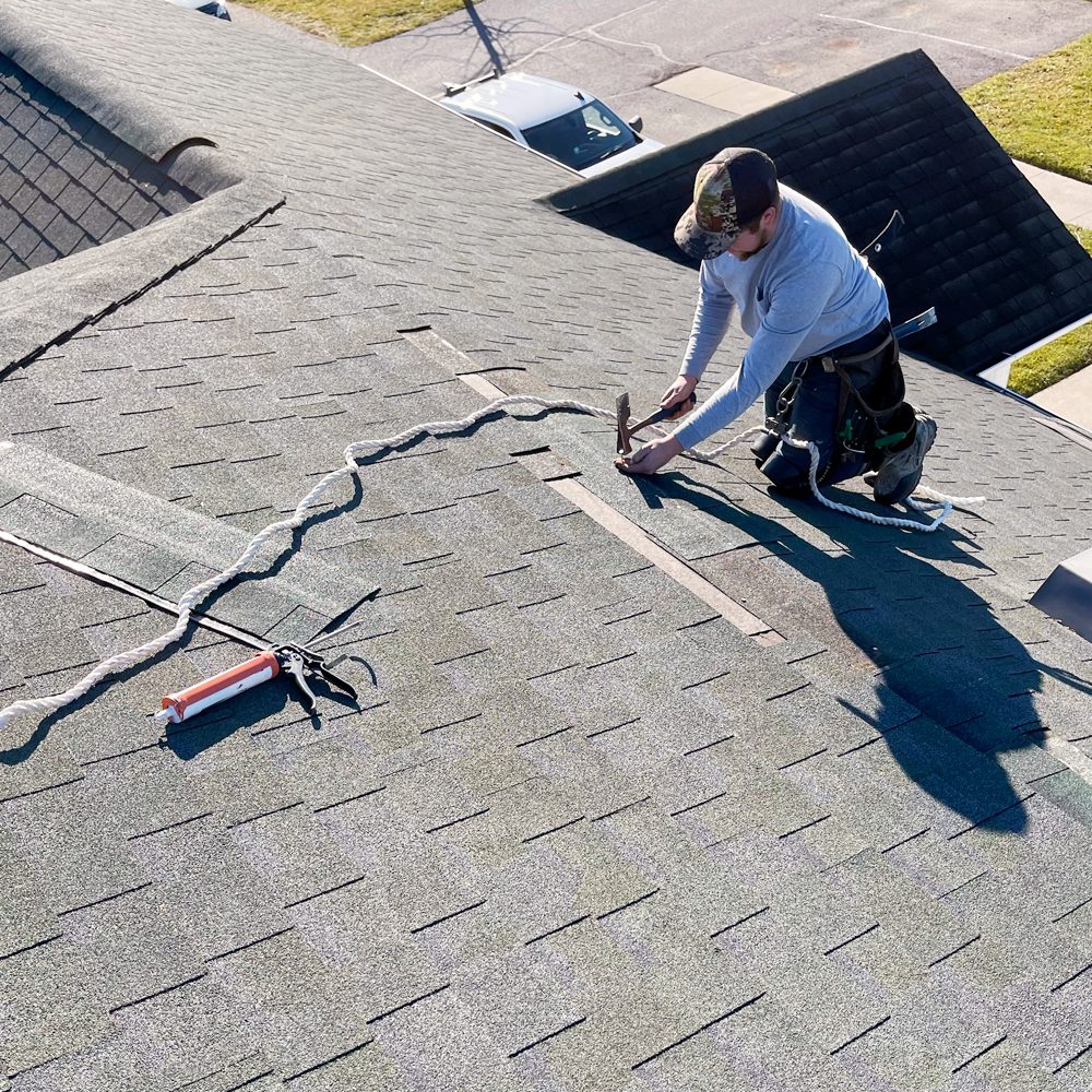 Roofer Working A Roof Repair