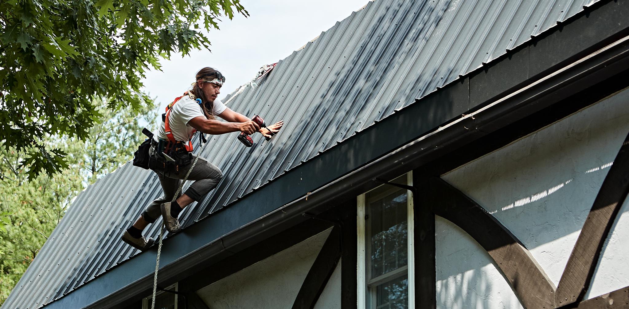 Roofer Installing Metal Roofing In Prince Edward County